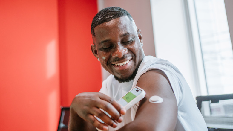man smiling about blood sugar level