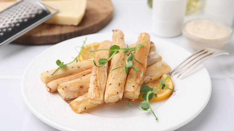 A plate of baked salsify with fresh herbs