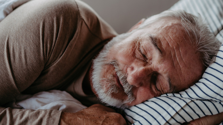 Senior man trying to fall asleep