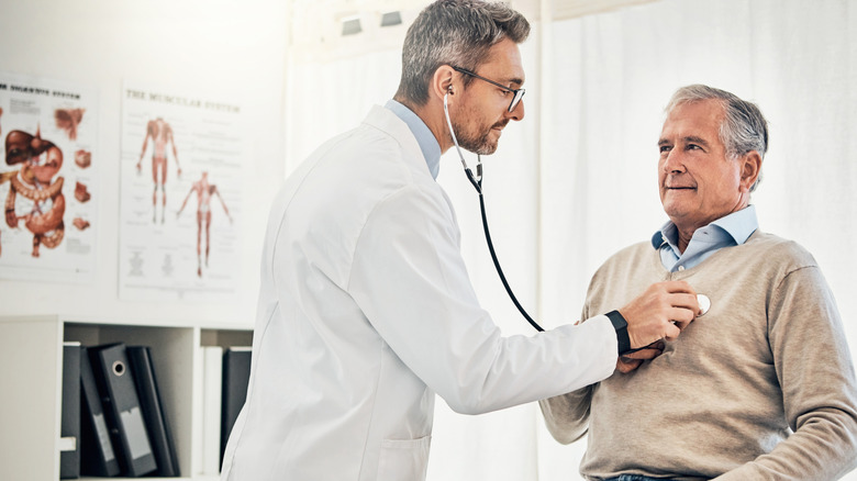 Doctor listening to a patient's lungs