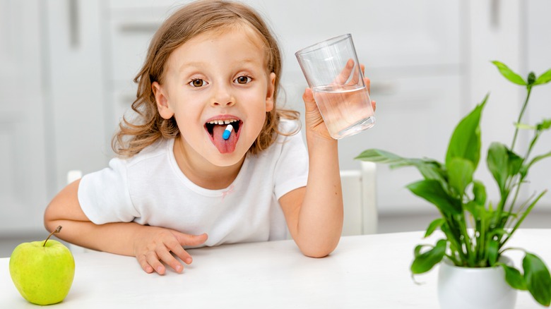 a child taking an antibiotic