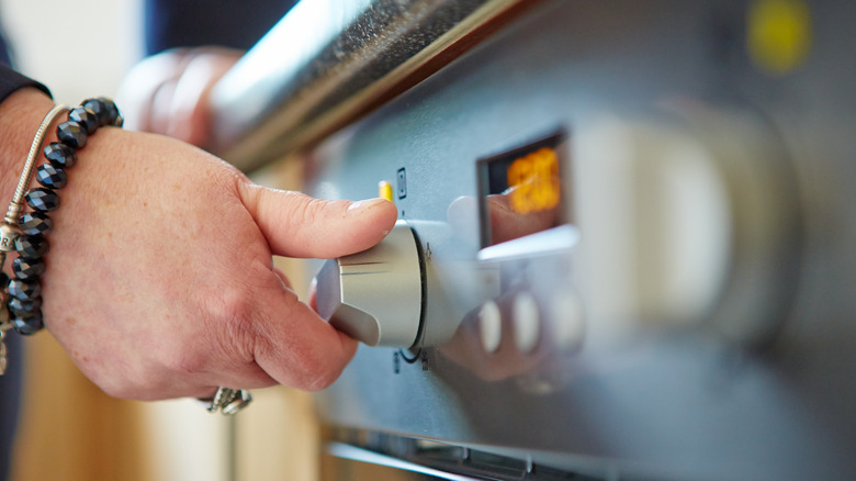 turning oven knob 