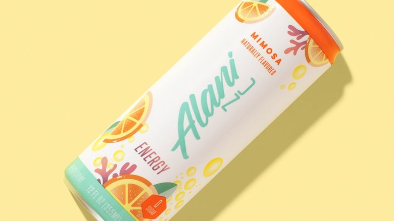 Can of Alani Nu energy drink on yellow background