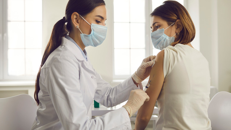 Doctor administering vaccine