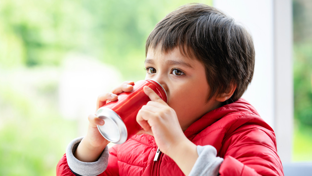 Woman pushing away sugary drink