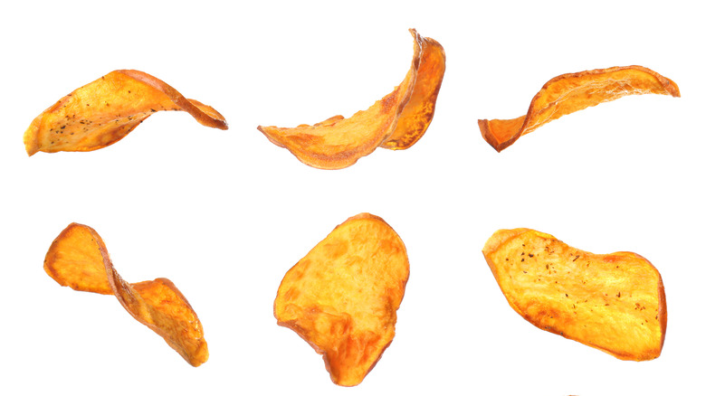 seasoned baked potato chips on an isolated white background 