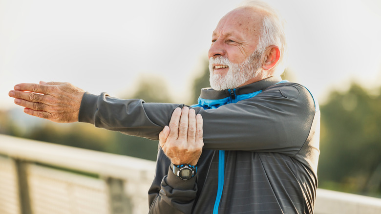 Older man stretching