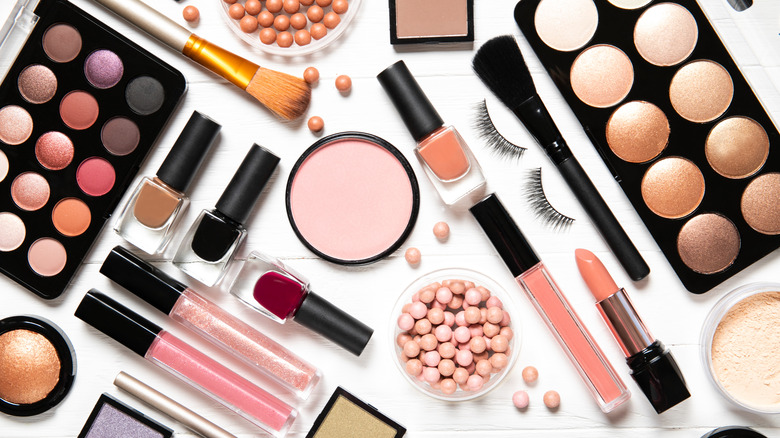 Makeup products on white background