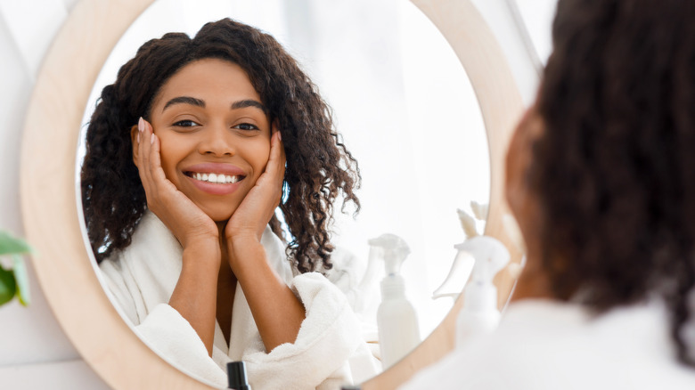 Woman smiling in mirror