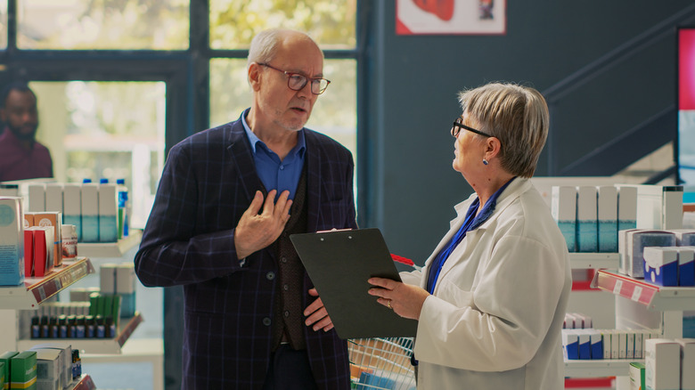 man asking pharmacist about heartburn medications