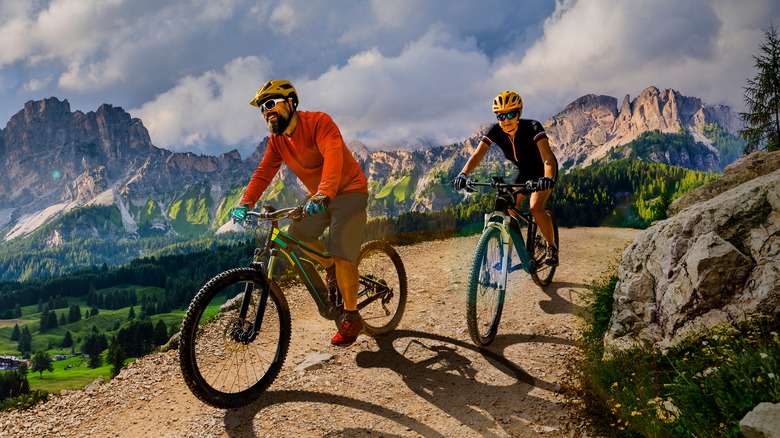 man and woman riding bikes