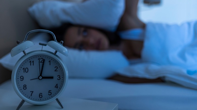 Woman in bed having trouble sleeping