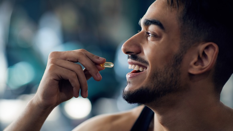 A man takes a multivitamin
