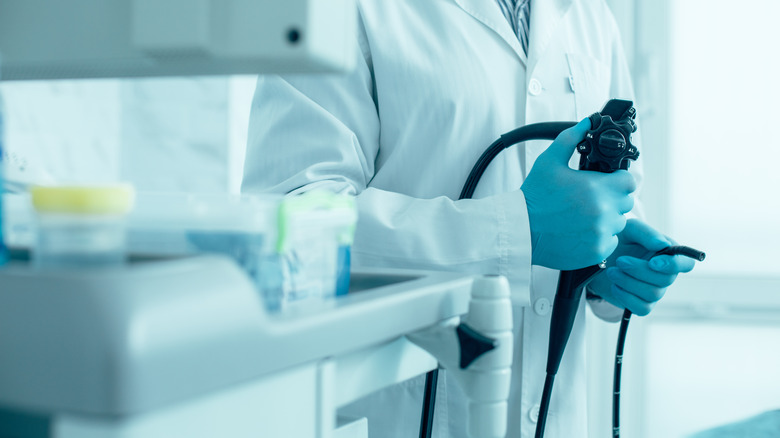 doctor holding endoscope