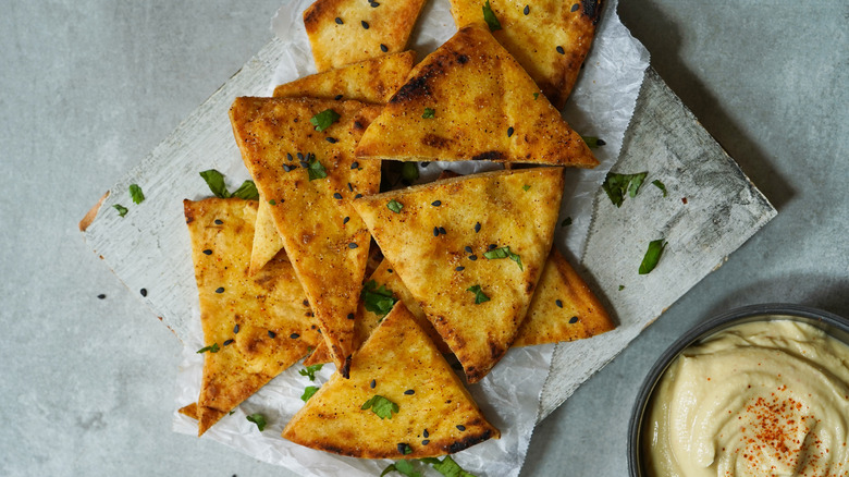 homemade pita chips with a side of hummus 