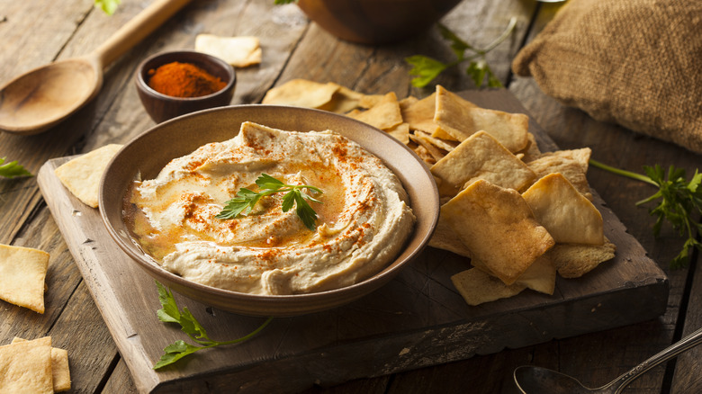 pita chips with a bowl of hummus