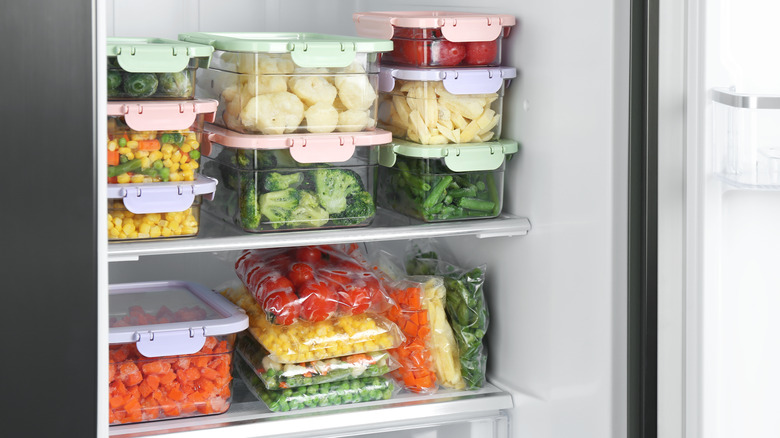 Food containers stacked in refrigerator