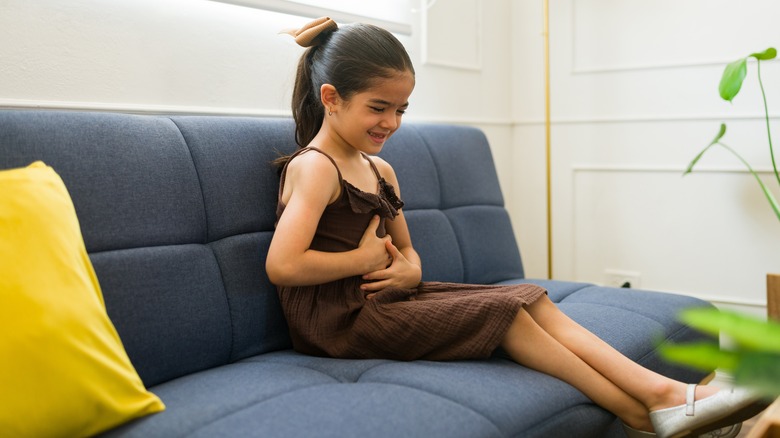 Young girl with stomach ache