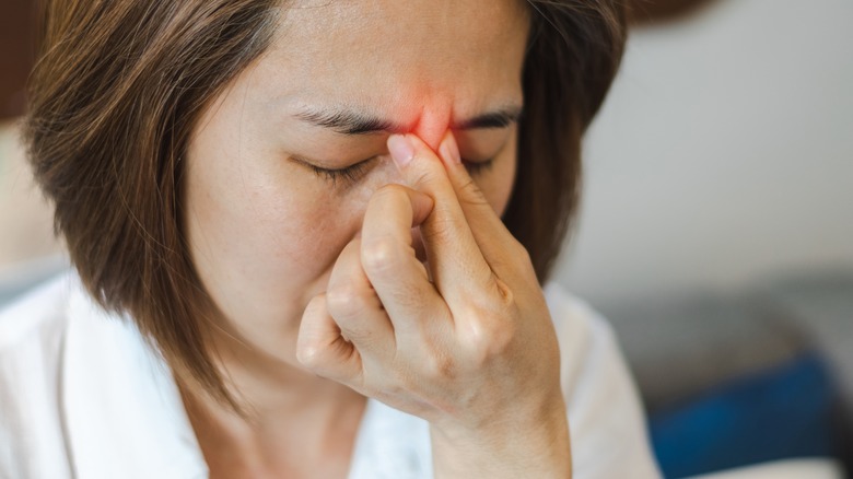 A woman with painful sinuses