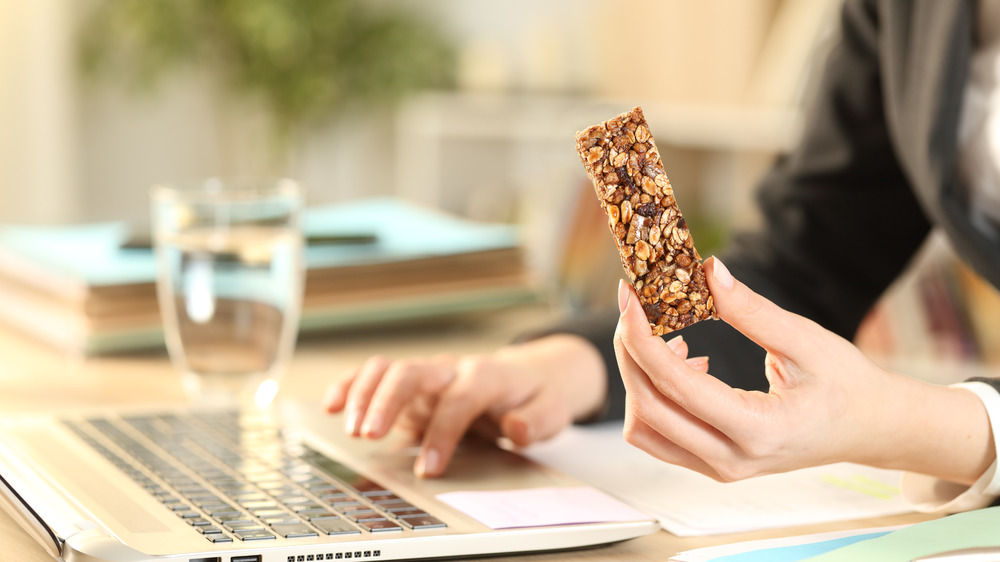 woman eating at desk