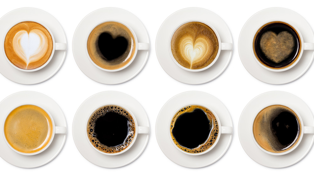 White cups of coffee made different ways 