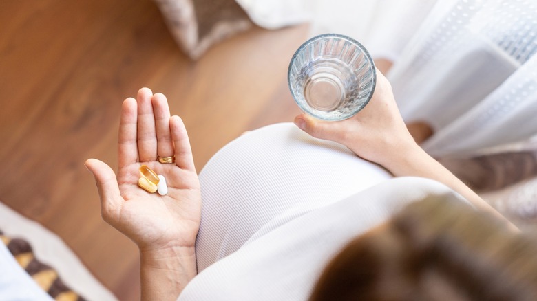 a pregnant woman takes medication