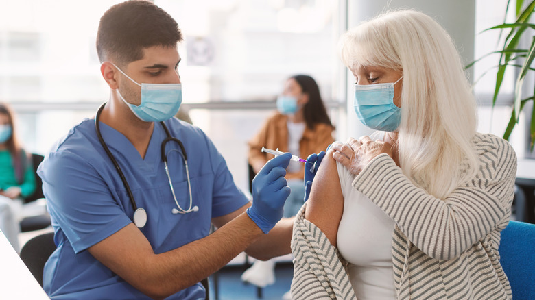 Older woman receiving vaccine