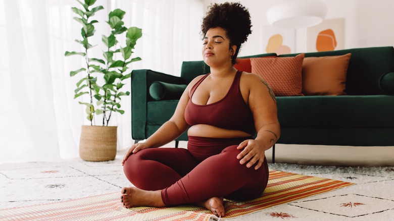 woman sitting cross legged