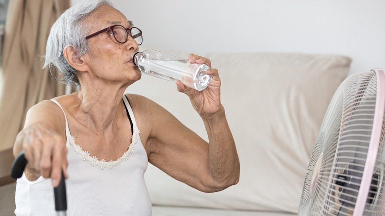 Senior woman staying cool