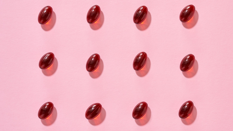 Red capsules on pink background