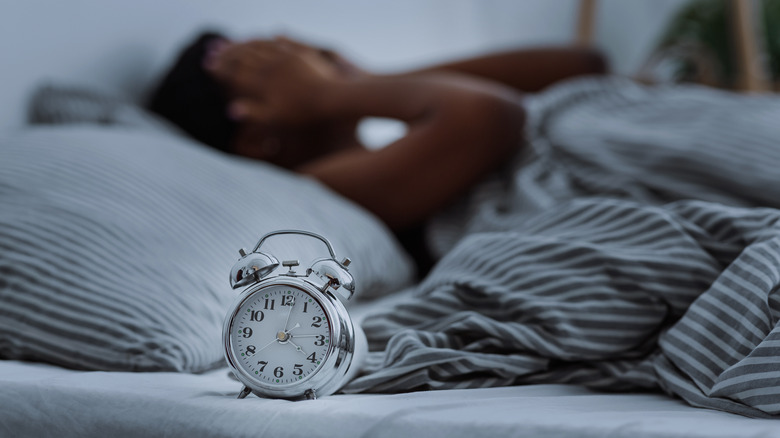 woman touching clock 