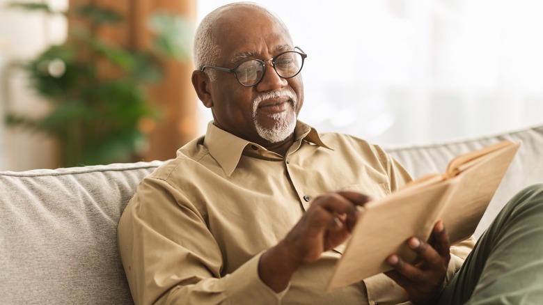 older man reading book