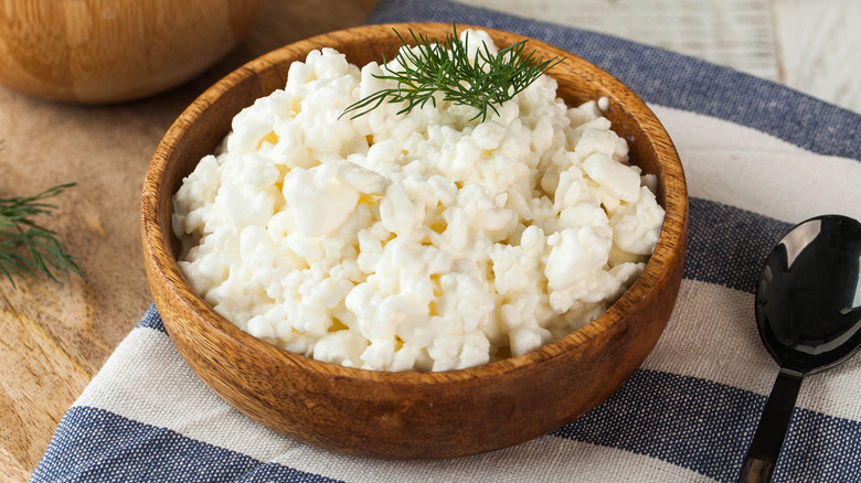 Wooden bowl of cottage cheese