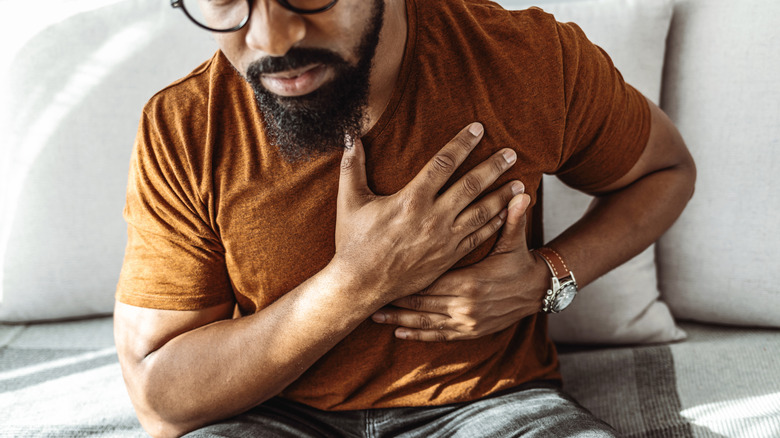 Man holding his chest
