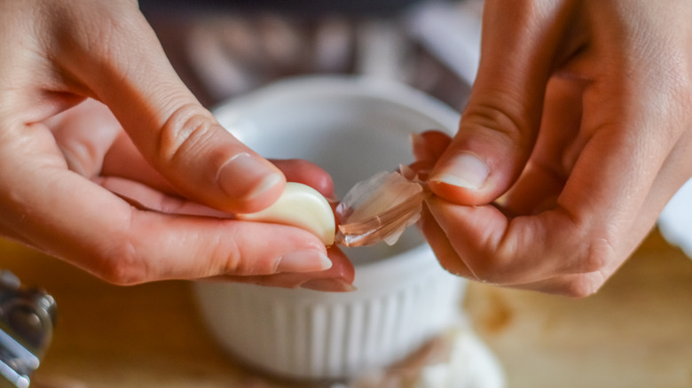 Woman peeling garlic