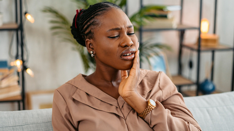 Woman with mouth pain