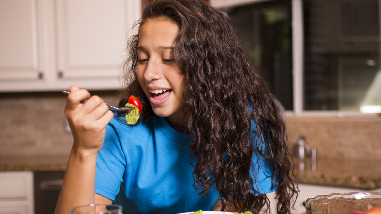 Woman eating at night