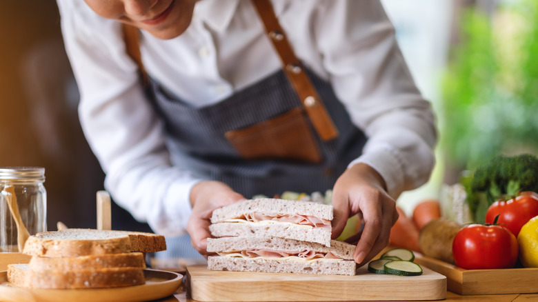 Woman preparing sandwiches