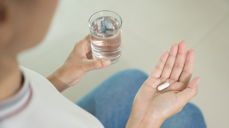 Pill with water