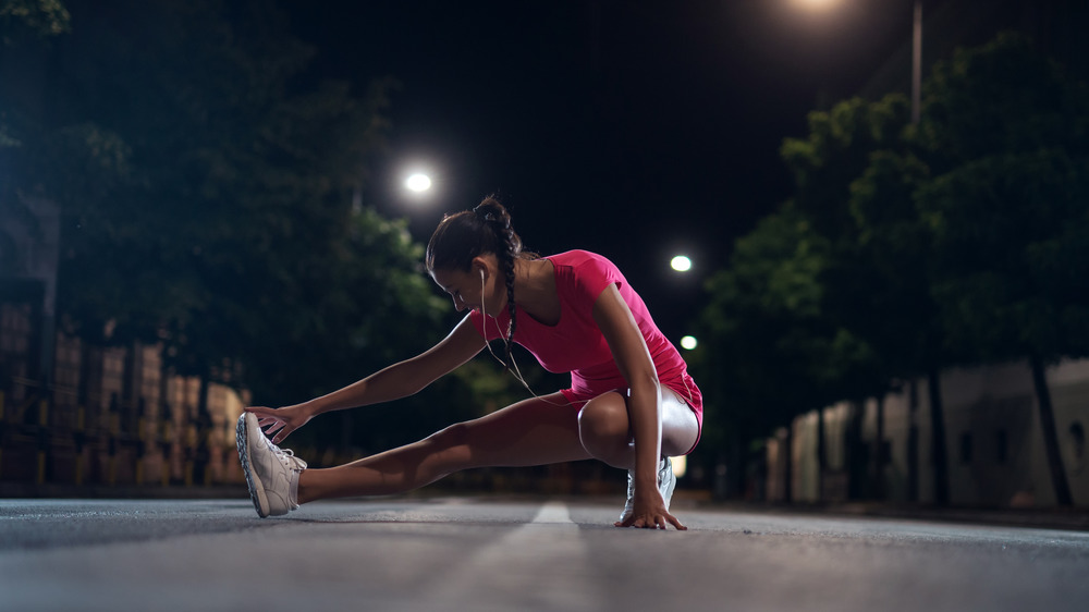 woman exercising at night