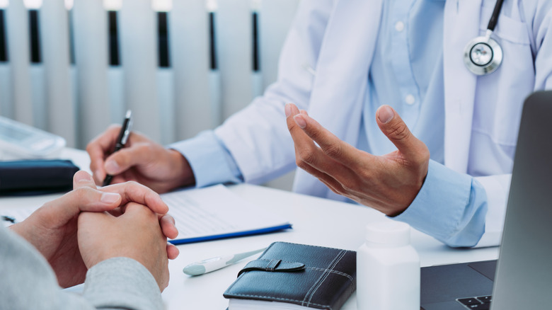 Patient talking to doctor