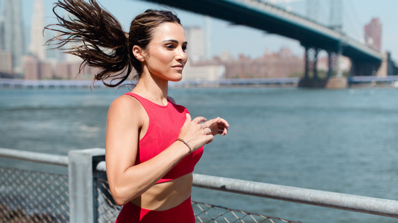 Andi Dorfman smiling while running