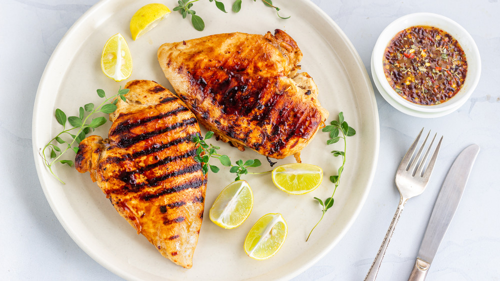 Grilled chicken on white plate
