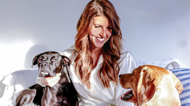 Gianna in bed with her two dogs