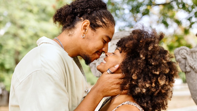 Smiling couple touching noses