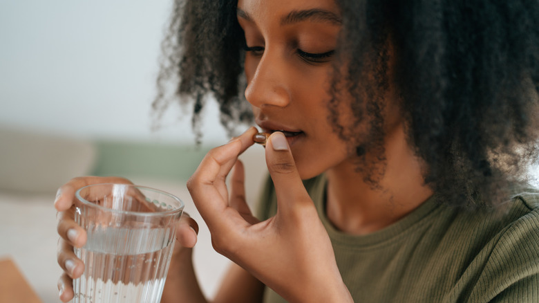 Woman taking pill