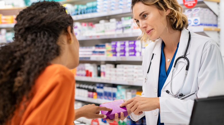 Pharmacist and woman discuss medication