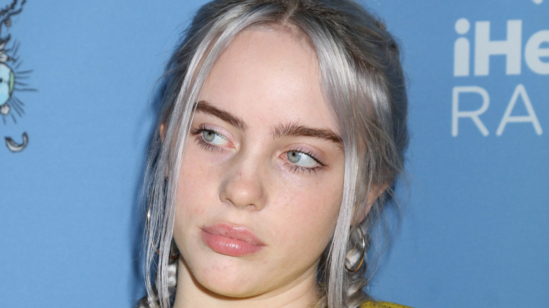 Billie Eilish with with silver hair streaks
