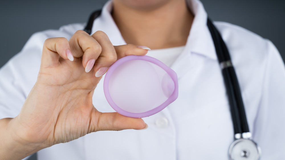 doctor holding diaphragm