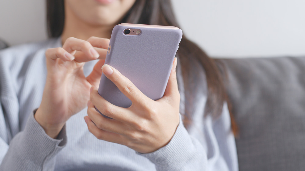Woman using phone app